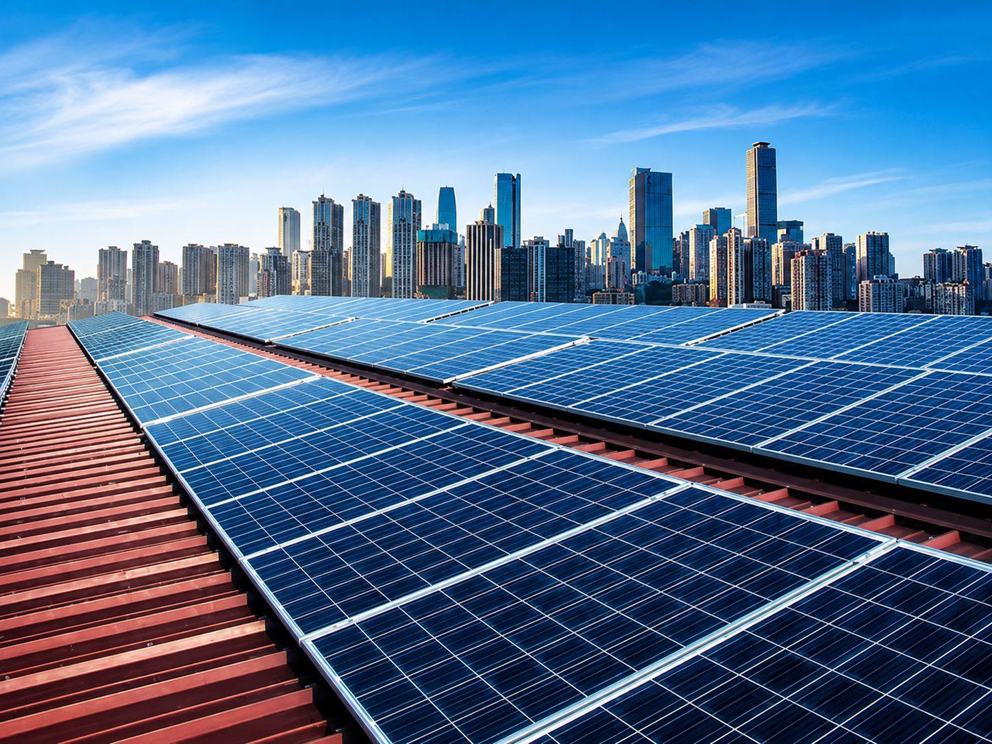A rooftop solar array above a city skyline